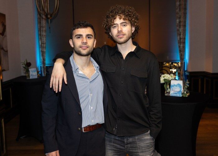 Matthew Modabber (left) with his arm around Shayne Coplan (right).